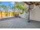 Private backyard with spiral staircase and patio at 1355 Pinellas Bayway S # 23, Tierra Verde, FL 33715