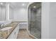 Modern bathroom featuring a glass shower enclosure and double vanity at 1355 Pinellas Bayway S # 23, Tierra Verde, FL 33715