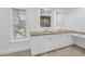 Elegant bathroom with double vanity, granite countertop, and large mirror at 1355 Pinellas Bayway S # 23, Tierra Verde, FL 33715