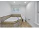 Relaxing bathroom with corner jacuzzi tub and tile surround at 1355 Pinellas Bayway S # 23, Tierra Verde, FL 33715