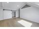 Charming bedroom with vaulted ceiling, barn door, and wood floors at 1355 Pinellas Bayway S # 23, Tierra Verde, FL 33715
