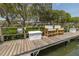 Community dock with seating and storage at 1355 Pinellas Bayway S # 23, Tierra Verde, FL 33715