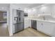 Modern kitchen featuring stainless steel appliances and white cabinetry at 1355 Pinellas Bayway S # 23, Tierra Verde, FL 33715