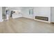 Open concept living room with hardwood floors and fireplace at 1355 Pinellas Bayway S # 23, Tierra Verde, FL 33715