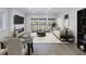 Open concept living space with fireplace and access to balcony at 1355 Pinellas Bayway S # 23, Tierra Verde, FL 33715
