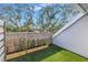 Private patio with artificial turf and wood planter boxes at 1355 Pinellas Bayway S # 23, Tierra Verde, FL 33715