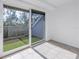 Bright sunroom with sliding glass doors leading to a private patio at 1355 Pinellas Bayway S # 23, Tierra Verde, FL 33715