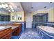 Bathroom with double vanity, shower, and blue tile at 13635 Twin Lakes Ln # 13635, Tampa, FL 33618