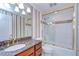 Bathroom with granite vanity and shower/tub combo at 13635 Twin Lakes Ln # 13635, Tampa, FL 33618