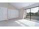 Bedroom with private balcony and neutral decor at 13635 Twin Lakes Ln # 13635, Tampa, FL 33618