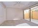Bright bedroom with patio access and walk-in closet at 13635 Twin Lakes Ln # 13635, Tampa, FL 33618
