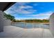 White wooden deck overlooking a tranquil lake at 13635 Twin Lakes Ln # 13635, Tampa, FL 33618