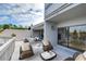 Outdoor deck with seating area and lake view at 13635 Twin Lakes Ln # 13635, Tampa, FL 33618