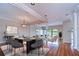Bright dining room with hardwood floors and modern chandelier at 13635 Twin Lakes Ln # 13635, Tampa, FL 33618