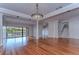 Elegant dining room, hardwood floors, and access to deck at 13635 Twin Lakes Ln # 13635, Tampa, FL 33618