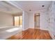 Hardwood floor entryway with access to living room and laundry at 13635 Twin Lakes Ln # 13635, Tampa, FL 33618