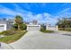 Three townhouses with gray exteriors and attached garages at 13635 Twin Lakes Ln # 13635, Tampa, FL 33618