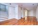 Bright hallway with hardwood floors, neutral walls, and white doors at 13635 Twin Lakes Ln # 13635, Tampa, FL 33618