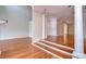 Bright hallway with hardwood floors and white columns at 13635 Twin Lakes Ln # 13635, Tampa, FL 33618