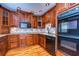 Kitchen with wood cabinets, granite counters and stainless steel appliances at 13635 Twin Lakes Ln # 13635, Tampa, FL 33618