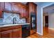 Kitchen with wood cabinets, granite counters and stainless steel appliances at 13635 Twin Lakes Ln # 13635, Tampa, FL 33618