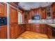 Kitchen with wood cabinets, granite counters and stainless steel appliances at 13635 Twin Lakes Ln # 13635, Tampa, FL 33618