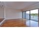 Living room with hardwood floors and access to deck at 13635 Twin Lakes Ln # 13635, Tampa, FL 33618