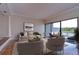 Living room with hardwood floors and water views at 13635 Twin Lakes Ln # 13635, Tampa, FL 33618