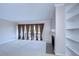 Living room with fireplace, built-in shelving and balcony access at 13635 Twin Lakes Ln # 13635, Tampa, FL 33618