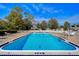 Inviting rectangular swimming pool with surrounding lounge chairs at 13635 Twin Lakes Ln # 13635, Tampa, FL 33618