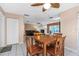 Dining area with view of living room and pool at 1392 Overlea Dr, Dunedin, FL 34698