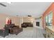 Living room with leather furniture and a fireplace at 1392 Overlea Dr, Dunedin, FL 34698