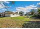 Expansive backyard featuring a covered patio and space for outdoor activities, perfect for relaxation and entertainment at 22368 Southshore Dr, Land O Lakes, FL 34639
