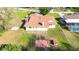 Large backyard with a partial patio area, offering space for outdoor entertaining and recreation at 22368 Southshore Dr, Land O Lakes, FL 34639
