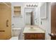 Bathroom featuring tiled shower and wooden vanity at 22368 Southshore Dr, Land O Lakes, FL 34639