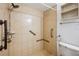 An accessible walk-in shower features updated fixtures and grab bars at 22368 Southshore Dr, Land O Lakes, FL 34639