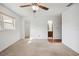 Bright bedroom with carpet, a ceiling fan, and ensuite bath with walk-in closet at 22368 Southshore Dr, Land O Lakes, FL 34639