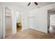 Bright bedroom with ceiling fan, closet, and an ensuite bathroom at 22368 Southshore Dr, Land O Lakes, FL 34639