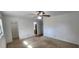 Bright bedroom with ceiling fan and large closet at 22368 Southshore Dr, Land O Lakes, FL 34639