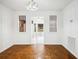 Dining room showcasing parquet floors, decorative windows and views to the living room at 22368 Southshore Dr, Land O Lakes, FL 34639