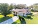 Charming single-story home with stone accents, a two-car garage, and a well-manicured lawn at 22368 Southshore Dr, Land O Lakes, FL 34639