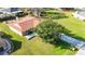 Well-maintained home with a stone facade, a two-car garage, and a sprawling green lawn at 22368 Southshore Dr, Land O Lakes, FL 34639