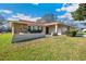 Attractive single-Gathering home featuring stone accents, a well-kept lawn, and a welcoming facade at 22368 Southshore Dr, Land O Lakes, FL 34639