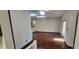 Upper level hallway with wood flooring and access to other rooms at 22368 Southshore Dr, Land O Lakes, FL 34639