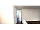Hallway featuring hardwood flooring and white walls at 22368 Southshore Dr, Land O Lakes, FL 34639