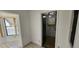 Small laundry room with linoleum flooring and built-in shelving at 22368 Southshore Dr, Land O Lakes, FL 34639