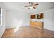 Bright room featuring tile floors and a custom wet bar with wooden cabinets at 22368 Southshore Dr, Land O Lakes, FL 34639