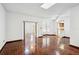Bright living room with wood parquet flooring, large windows and access to other rooms at 22368 Southshore Dr, Land O Lakes, FL 34639