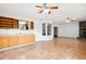 Open-concept room with tile flooring, fireplace and a wet bar, perfect for entertaining at 22368 Southshore Dr, Land O Lakes, FL 34639