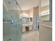 Spa-like bathroom featuring a walk-in shower and double vanity at 2337 Platinum Dr, Sun City Center, FL 33573